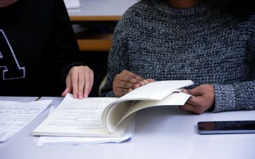 woman flipping book page